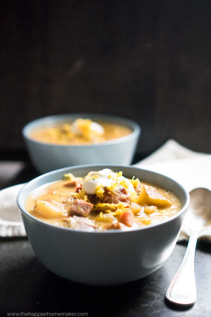 Cheesy Bacon Ham Potato Soup in blue bowl 