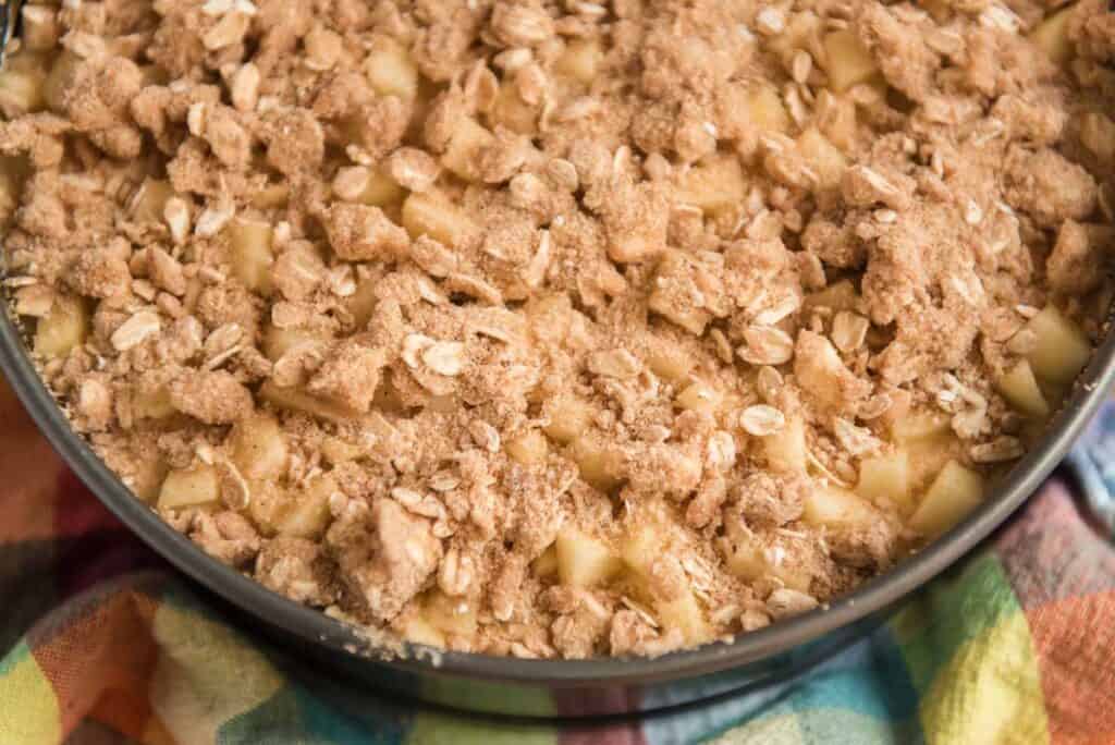 apple crisp cheesecake before baking