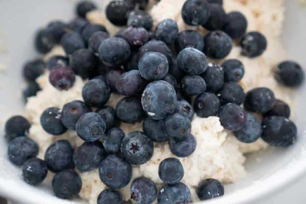 blueberry buttermilk biscuit dough with blueberries on top