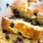 blueberry bread sliced on cutting board