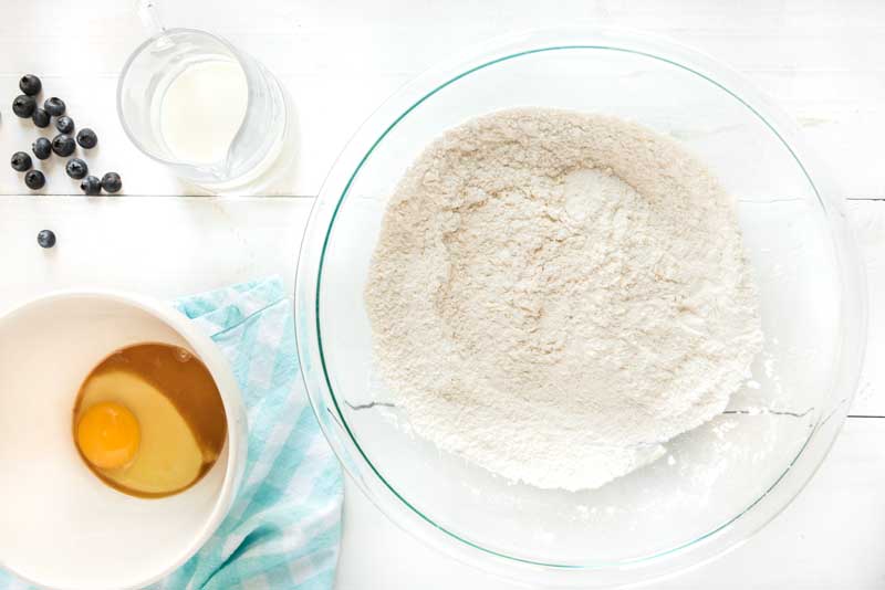 blueberry muffin ingredients in bowls