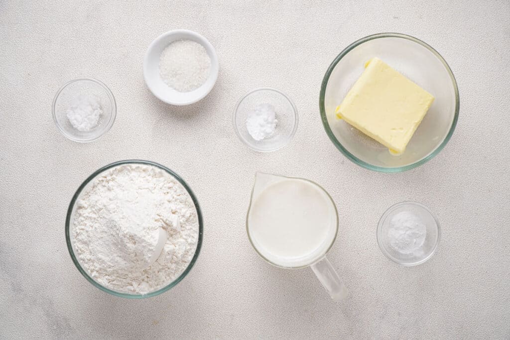 ingredients for buttermilk biscuits on marble countertop