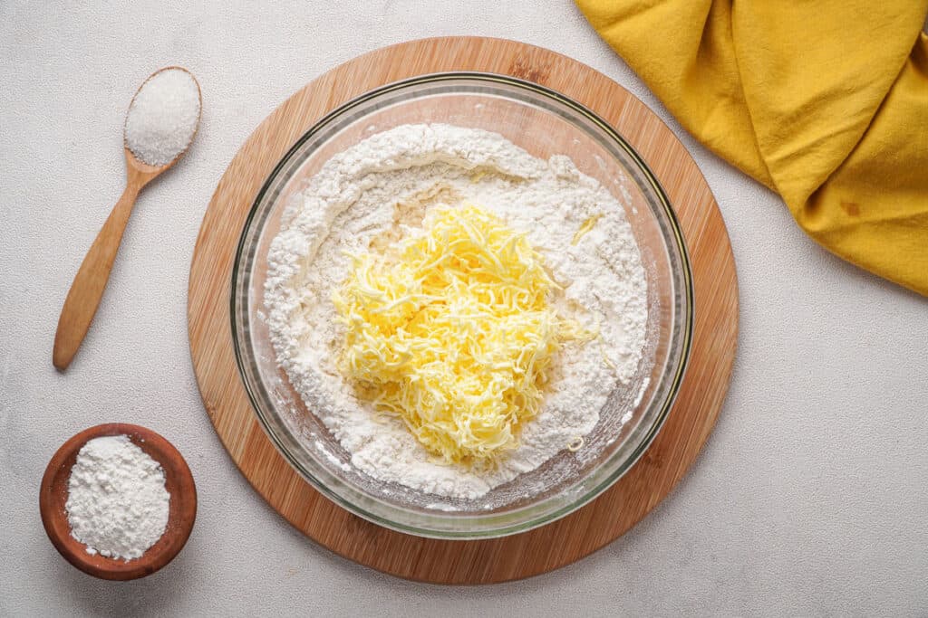 shaved butter in bowl of flour