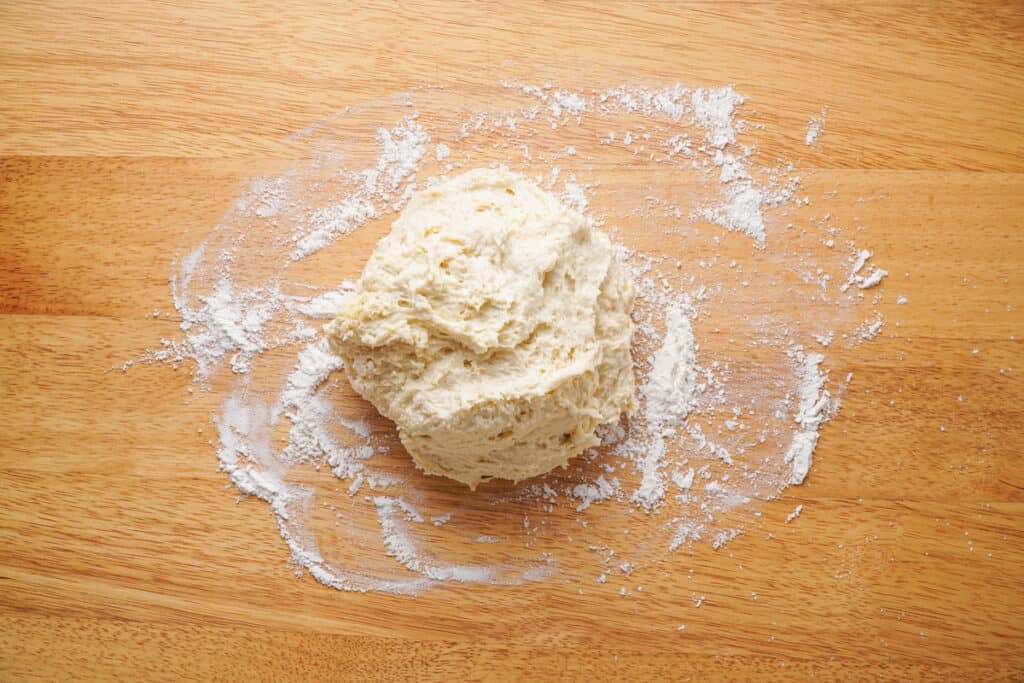 ball of dough on wood counter