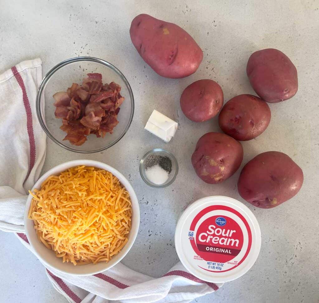 ingredients for cheesy potato casserole on countertop