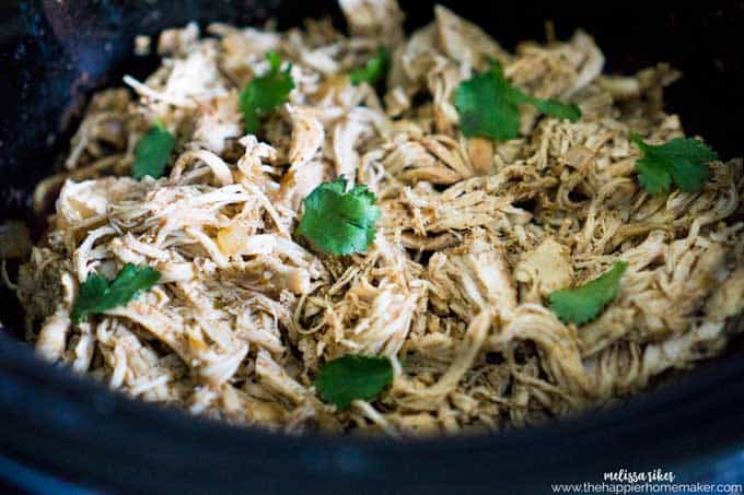 Slow cooker carnitas style chicken in a slow cooker