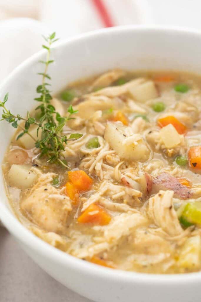 white bowl with chicken pot pie soup