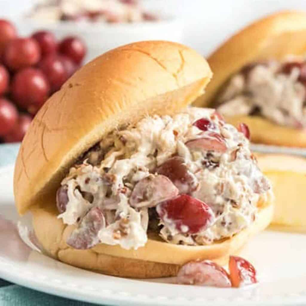 grape and pecan chicken salad on sandwich bun