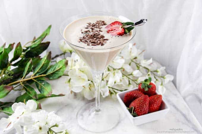chocolate martini with shaved chocolate and a slice of strawberry