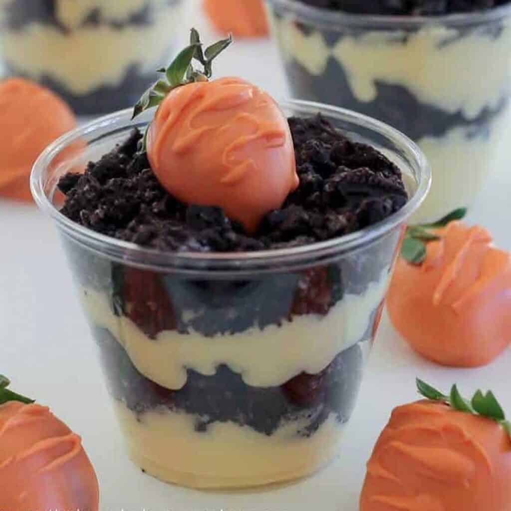 easter dirt cake cup with chocolate covered strawberry