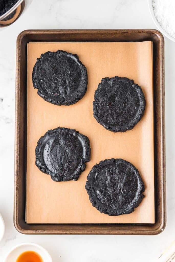 large Oreo chocolate cookies on baking sheet