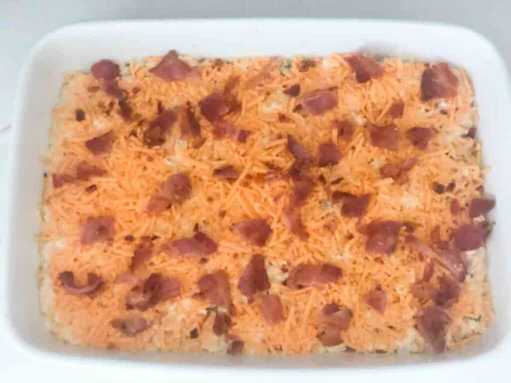 bacon jalapeño cheddar cornbread before baking in white casserole dish