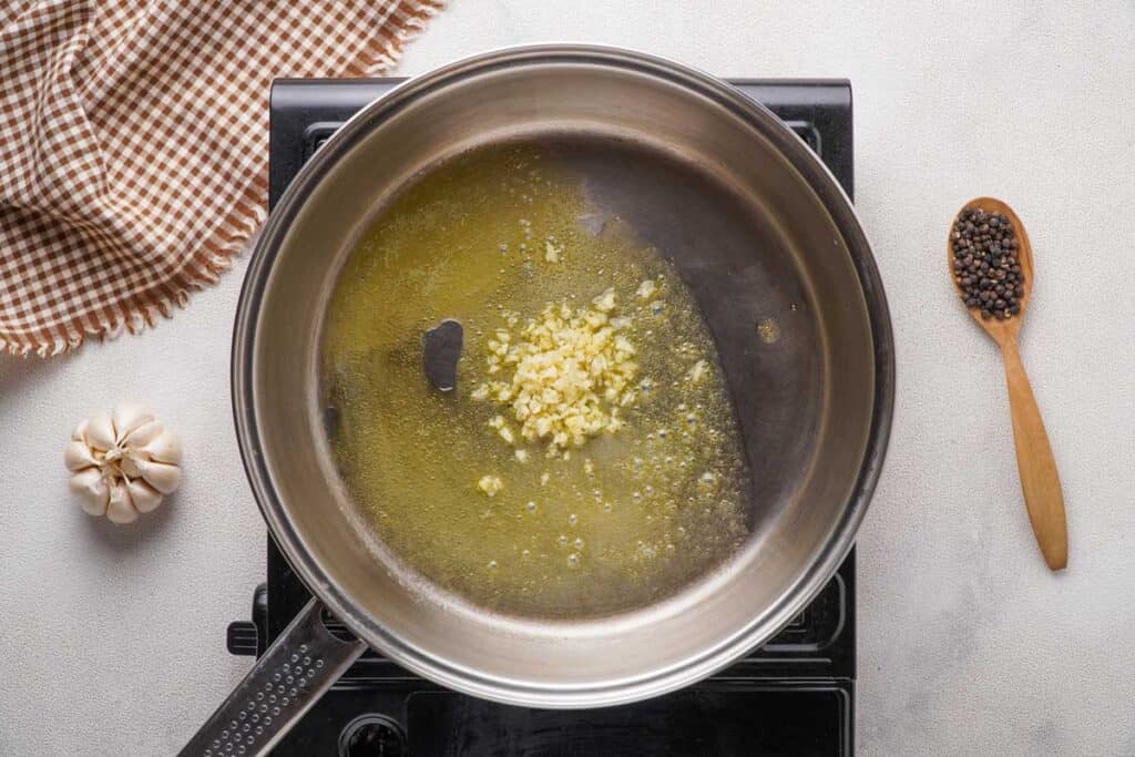 pan with melted butter and garlic