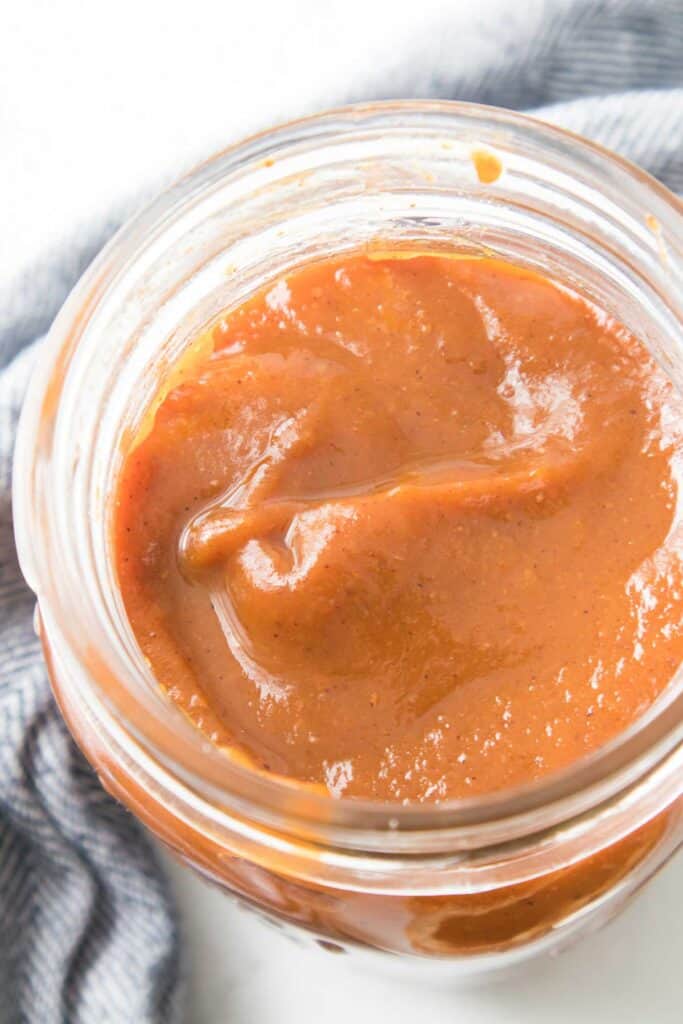 close up of pumpkin butter in glass jar