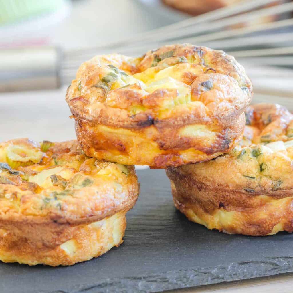 three egg bites stacked on slate platter