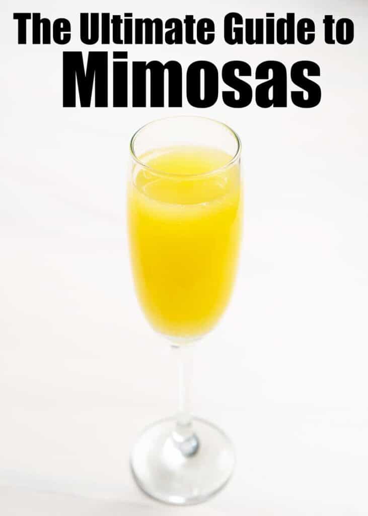 mimosa in champagne flute on white marble with Ultimate guide to mimosas text overlay