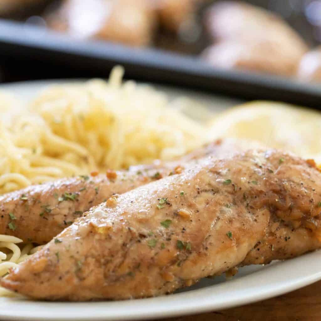 two baked chicken tenders with pasta