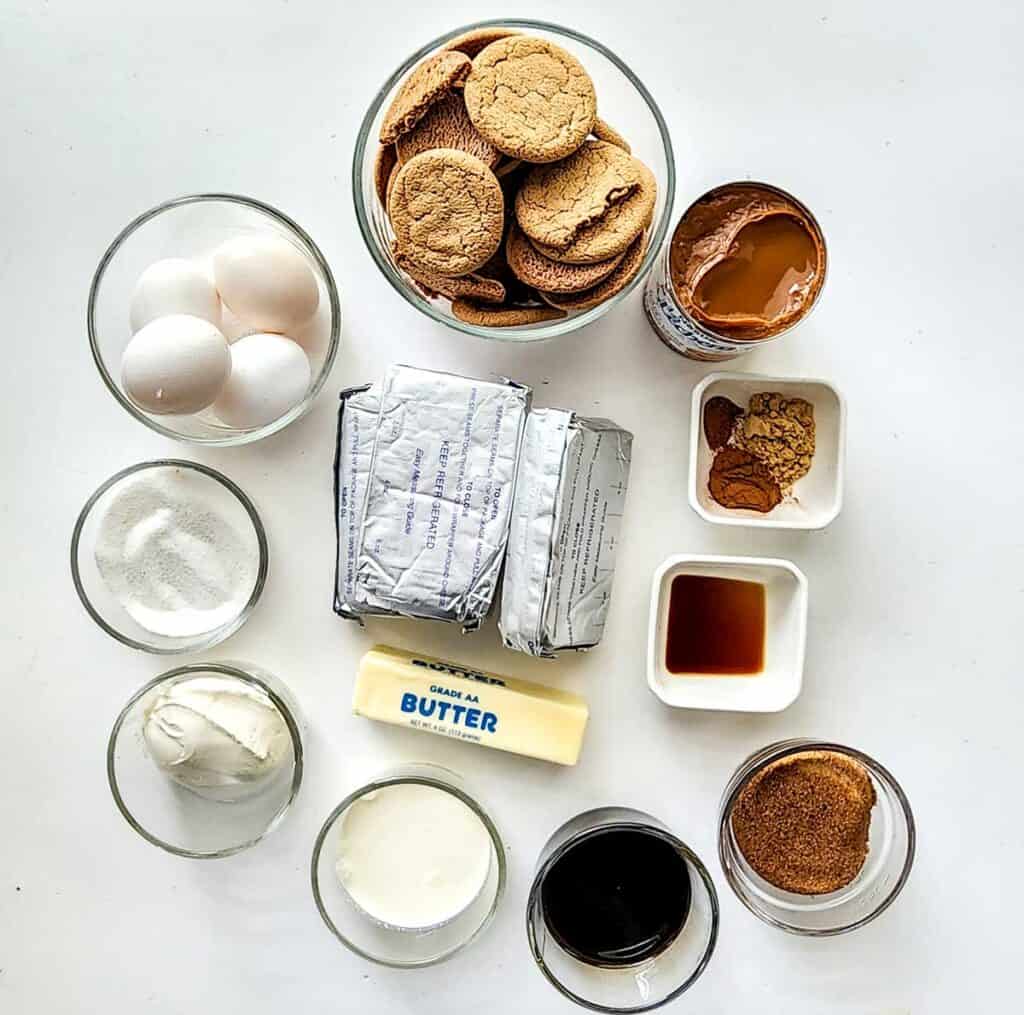 gingerbread cheesecake ingredients on white countertop