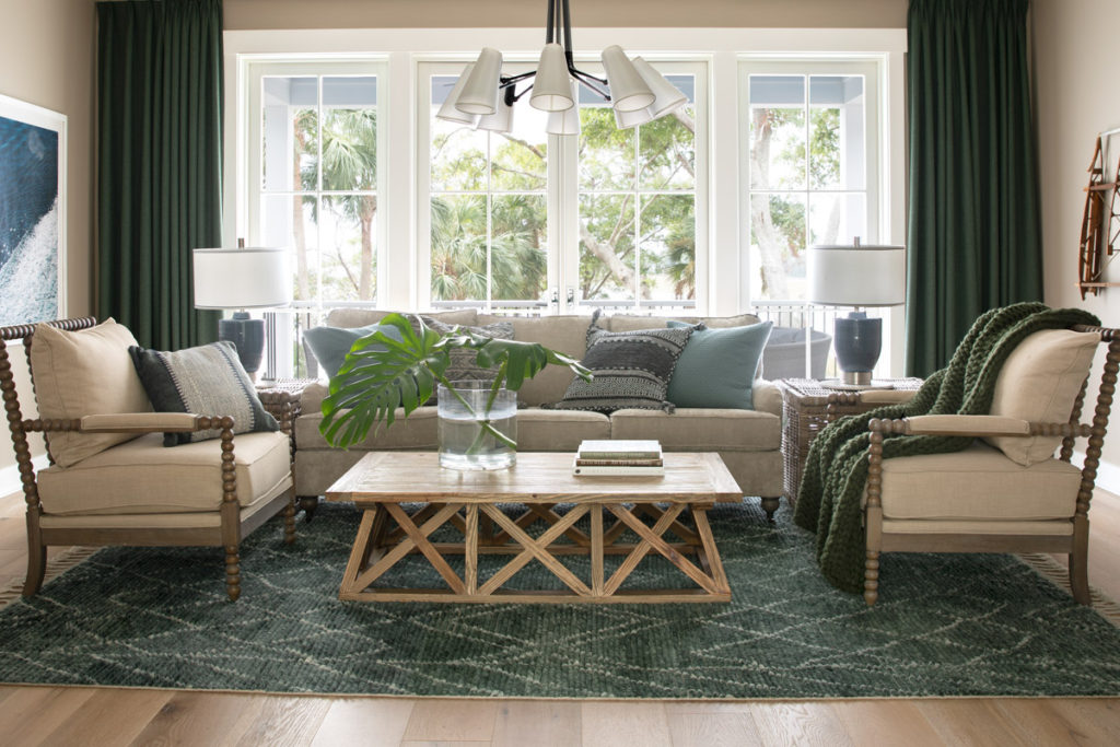 A living room filled with seating furniture and a large window from the hgtv dream home 2020