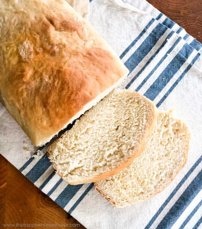 overhead view of two slices cut from loaf of homemade bread