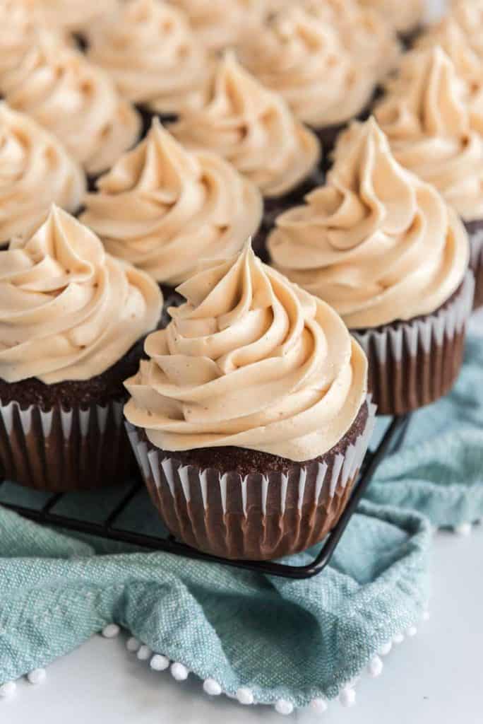 peanut butter buttercream frosting on chocolate cupcake