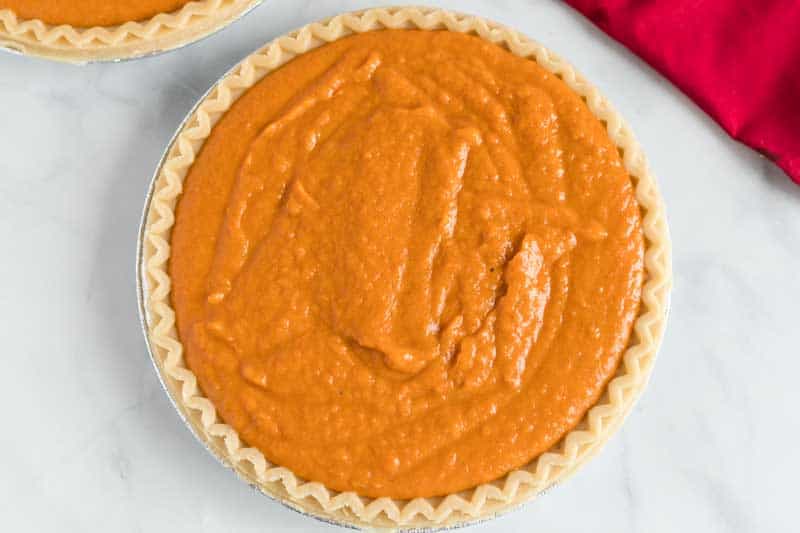 unbaked old fashioned sweet potato pie on marble counter