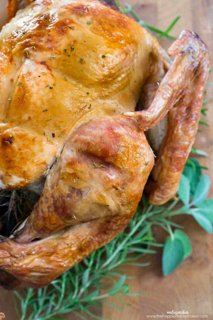 A close up of cooked Thanksgiving turkey garnished with greens