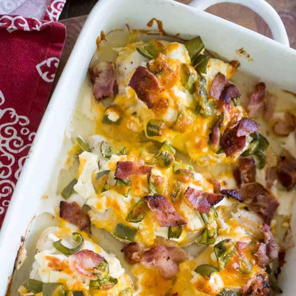 jalapeño popper chicken in white baking dish