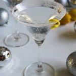 A Lemon drop Martini garnished with a twist of lemon peel