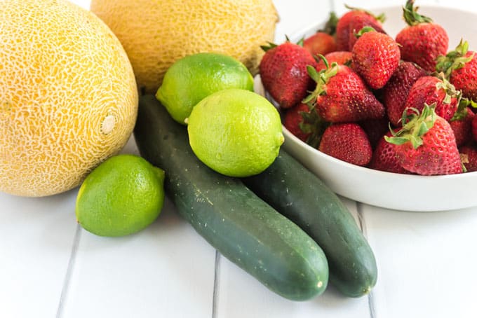 cantaloupe, limes, strawberries and cucumbers