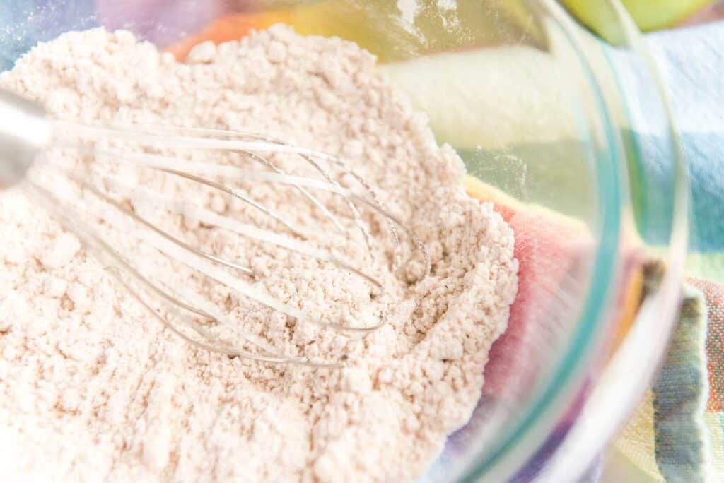 stirring flour mixture in glass bowl