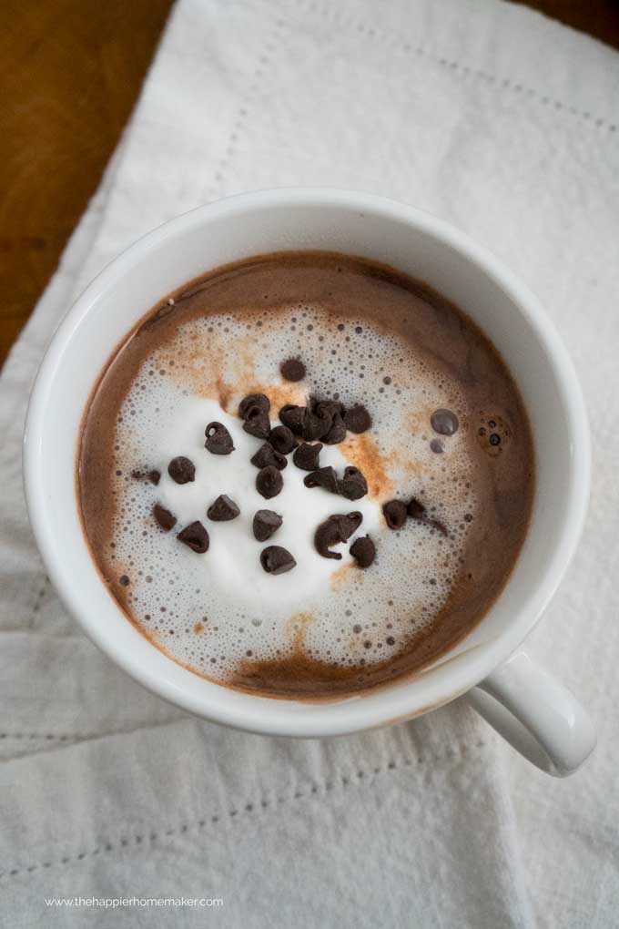 mug of hot chocolate with Nutella on a white table cloth