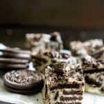 A close up of a piece of three ingredient Oreo cookie with chocolate fudge and Oreos