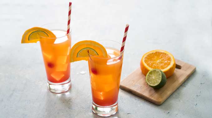 two glasses of planters punch cocktails