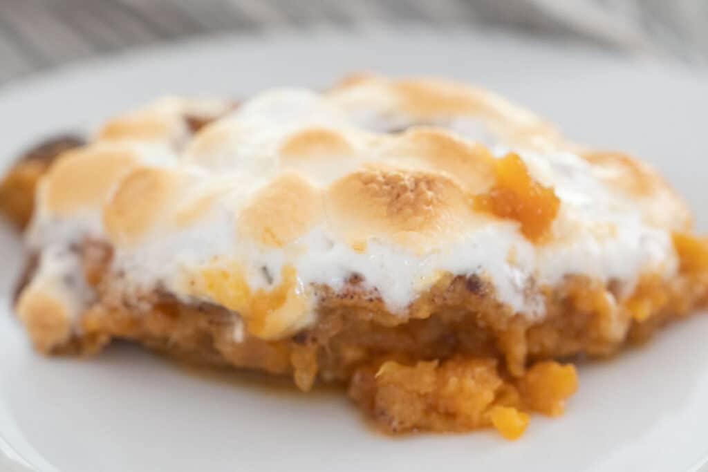 serving of sweet potato casserole on white plate