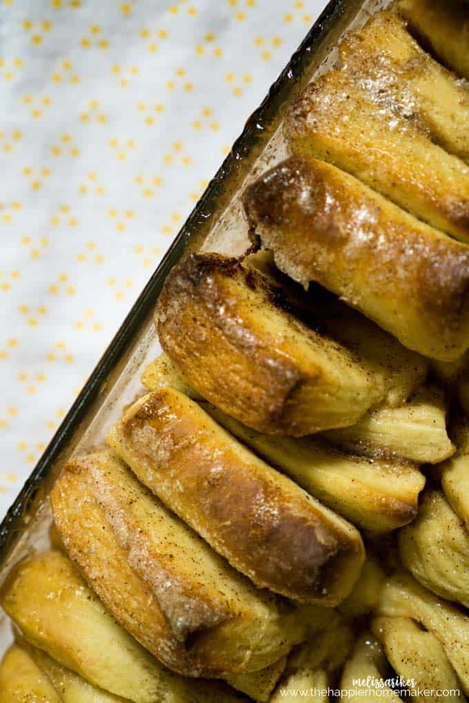 close up of cinnamon sugar pull apart bread in a glass baking dish