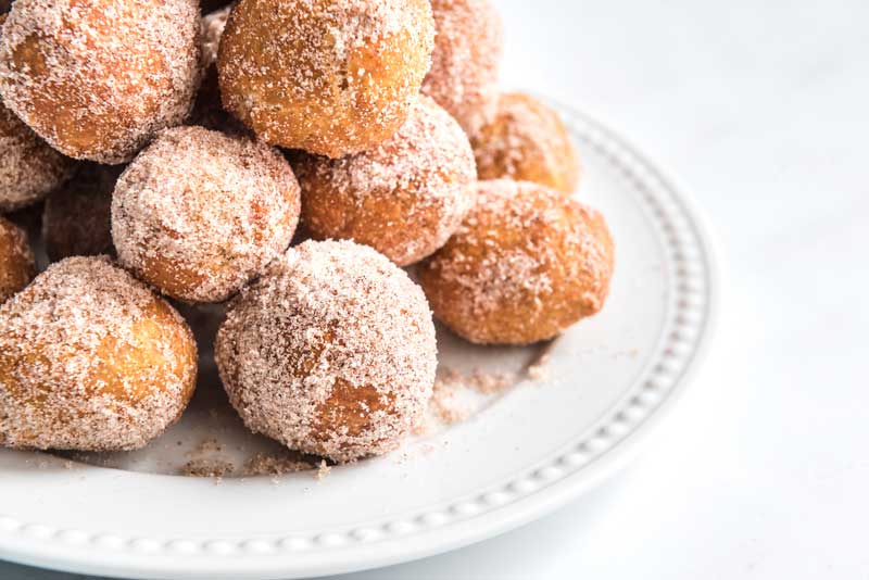 pumpkin doughnut holes on white plate