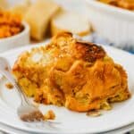 pumpkin bread pudding on white plate with fork