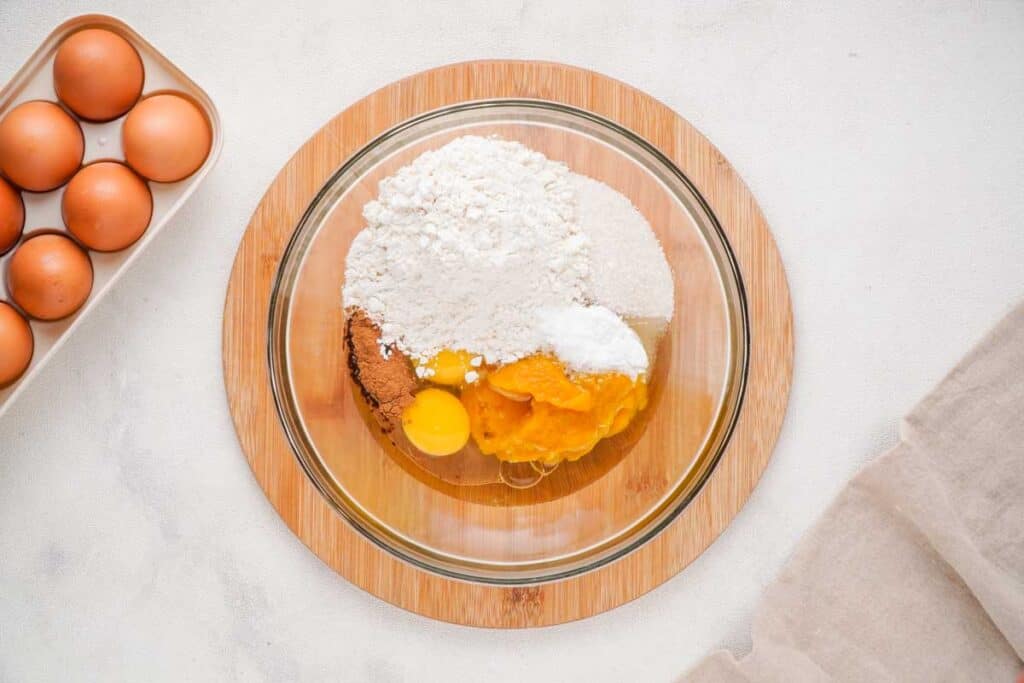 pumpkin bread ingredients in glass bowl