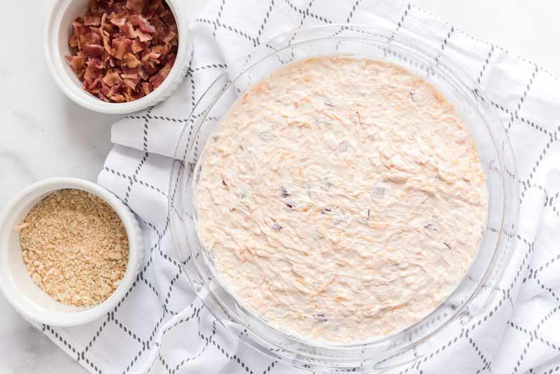 Charleston cheese dip mixed in glass bowl before baking