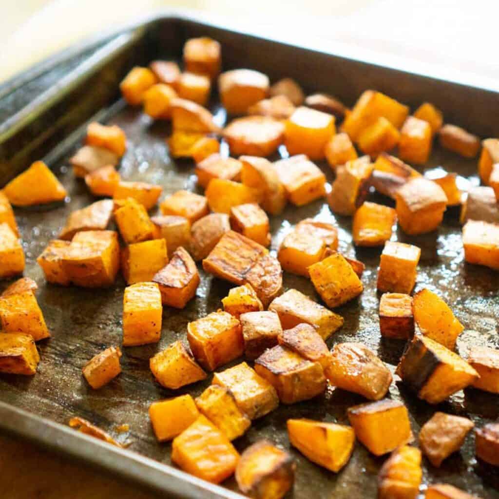roasted diced sweet potatoes on baking sheet