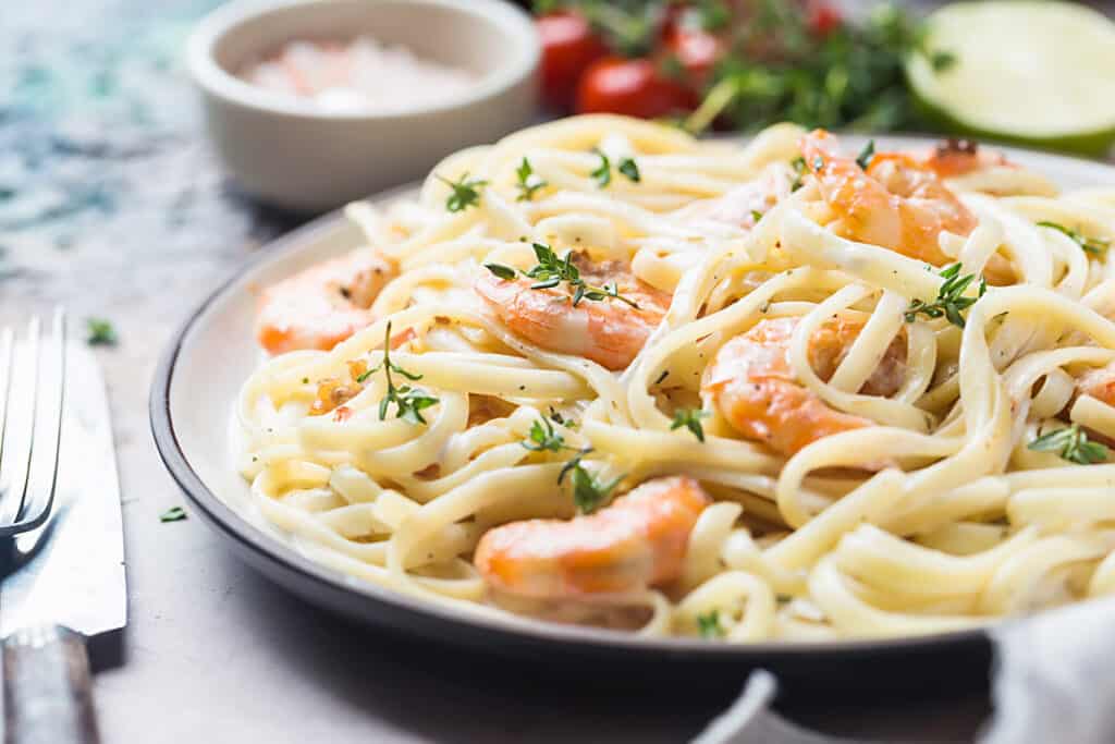 shrimp alfredo with parsley garnish