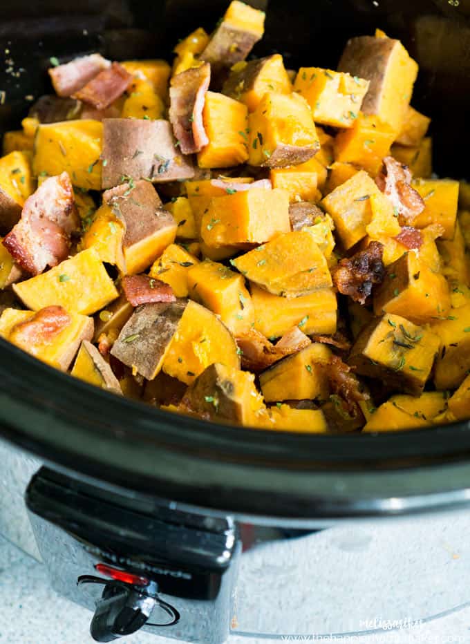 raw diced sweet potatoes with bacon and parsley in a slow cooker