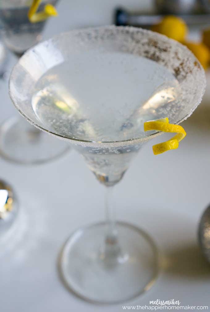 A close up of a Lemon drop Martini garnished with a twist of lemon peel