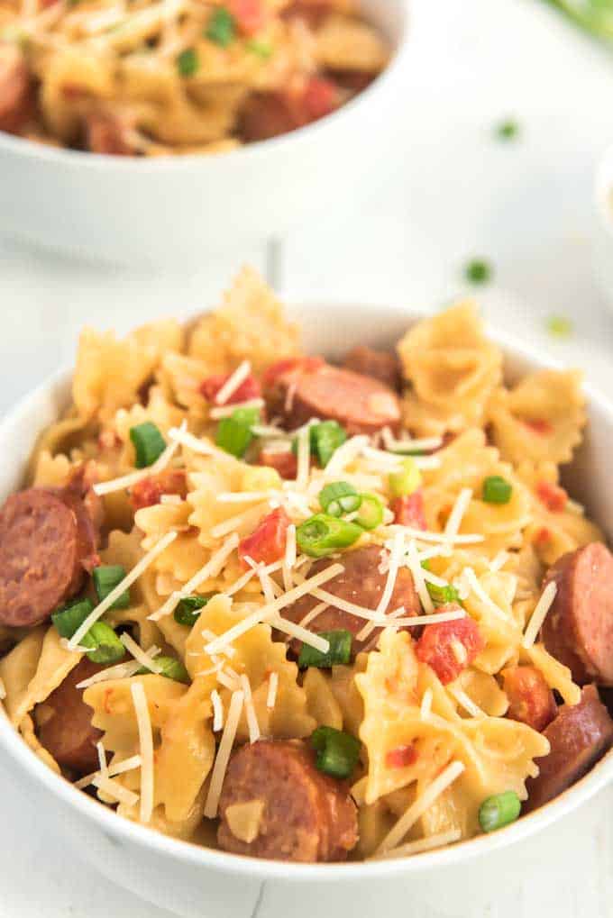 spicy sausage pasta in white bowl