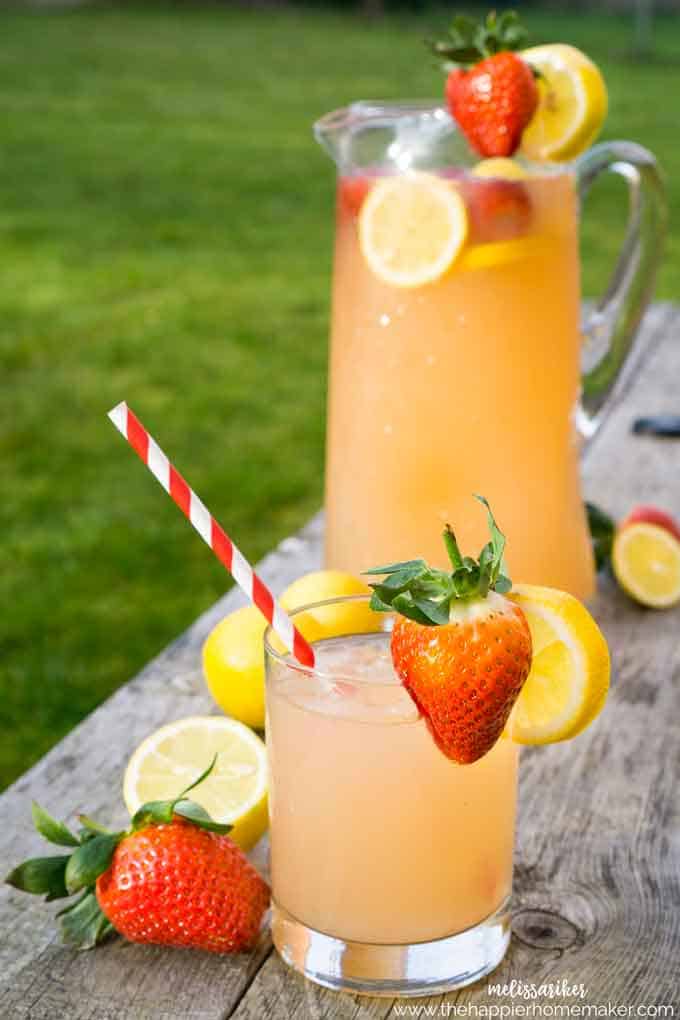 strawberry lemonade with fresh strawberries in pitcher
