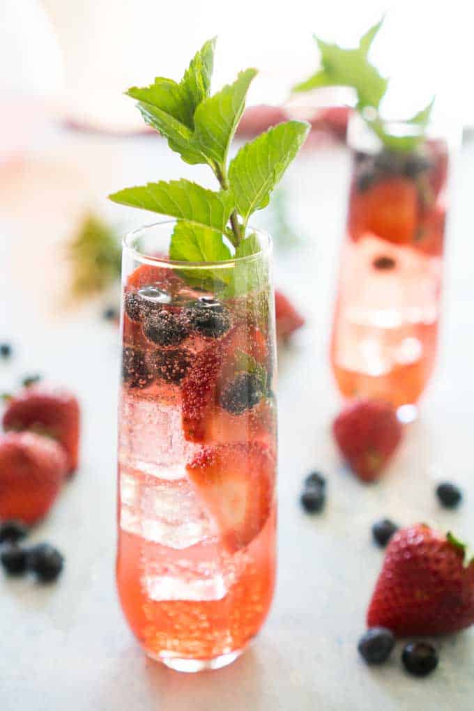 summer berry sangria in stemless champagne flute