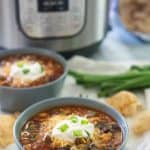 taco soup in a bowl with tortilla chips