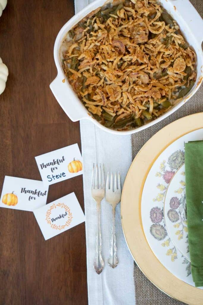 table setting with green bean casserole and thanksgiving place cards