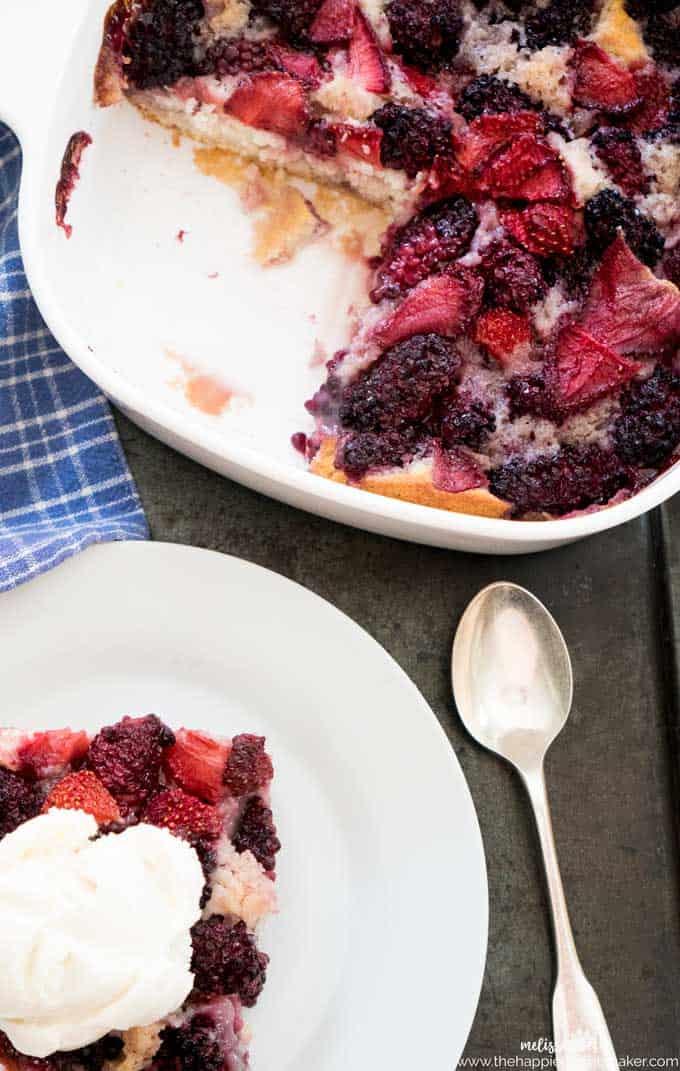 strawberry and blackberry cobbler in a white casserole dish